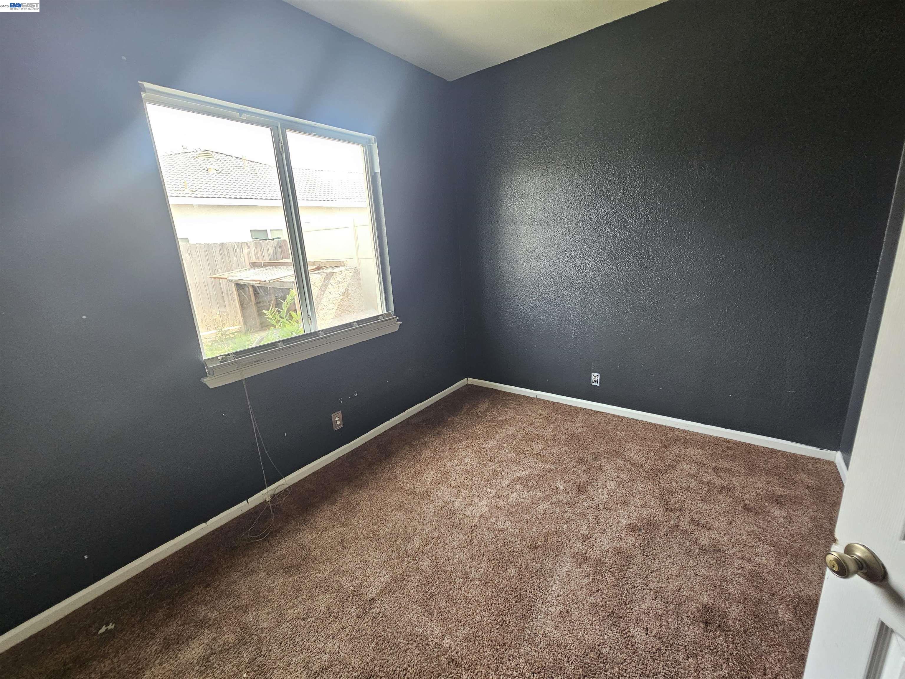 537 Bonanza Drive Newman, CA 95360 - Photo 12 of 16 an empty room with a window