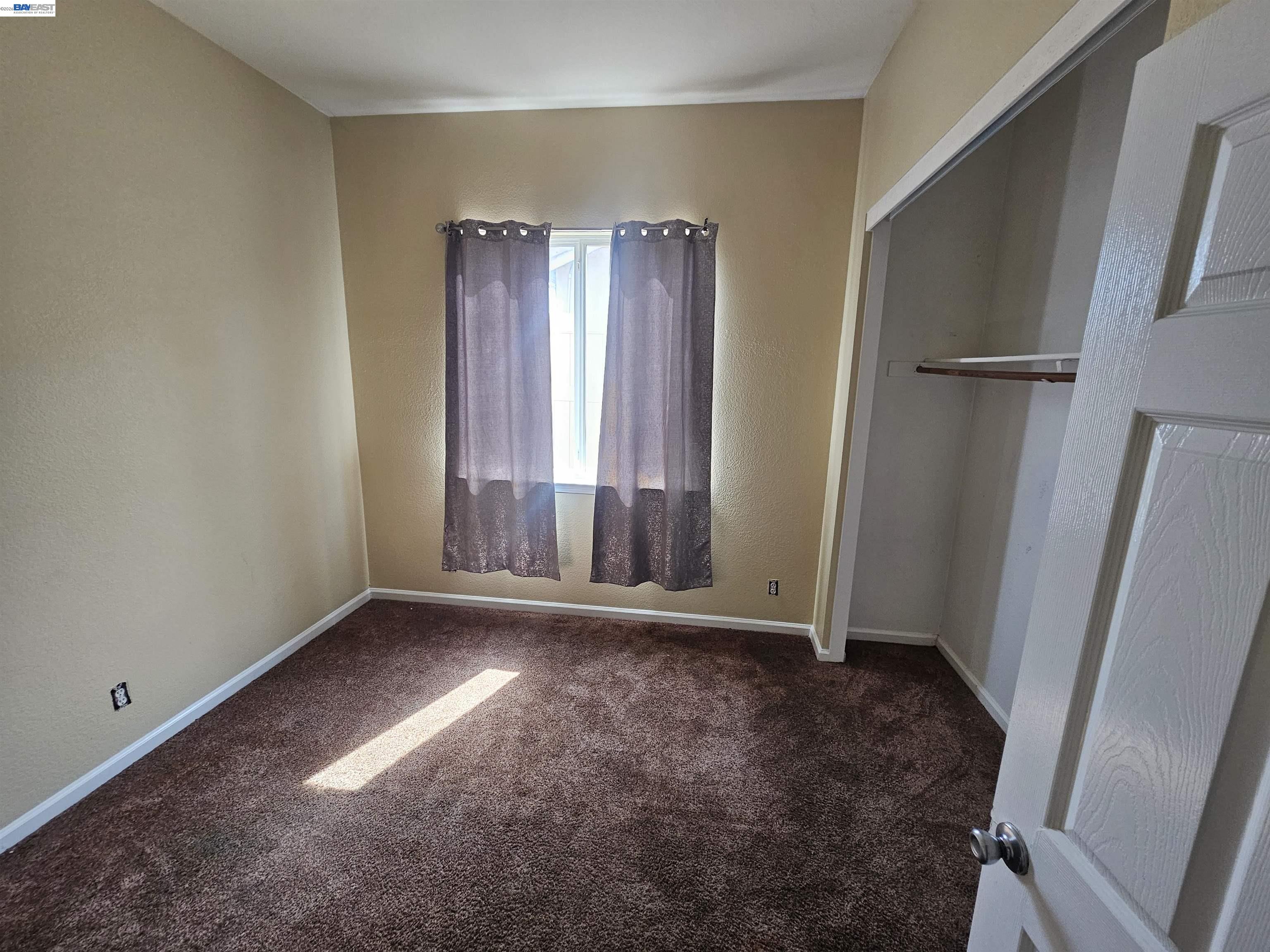 537 Bonanza Drive Newman, CA 95360 - Photo 13 of 16 an empty room with windows