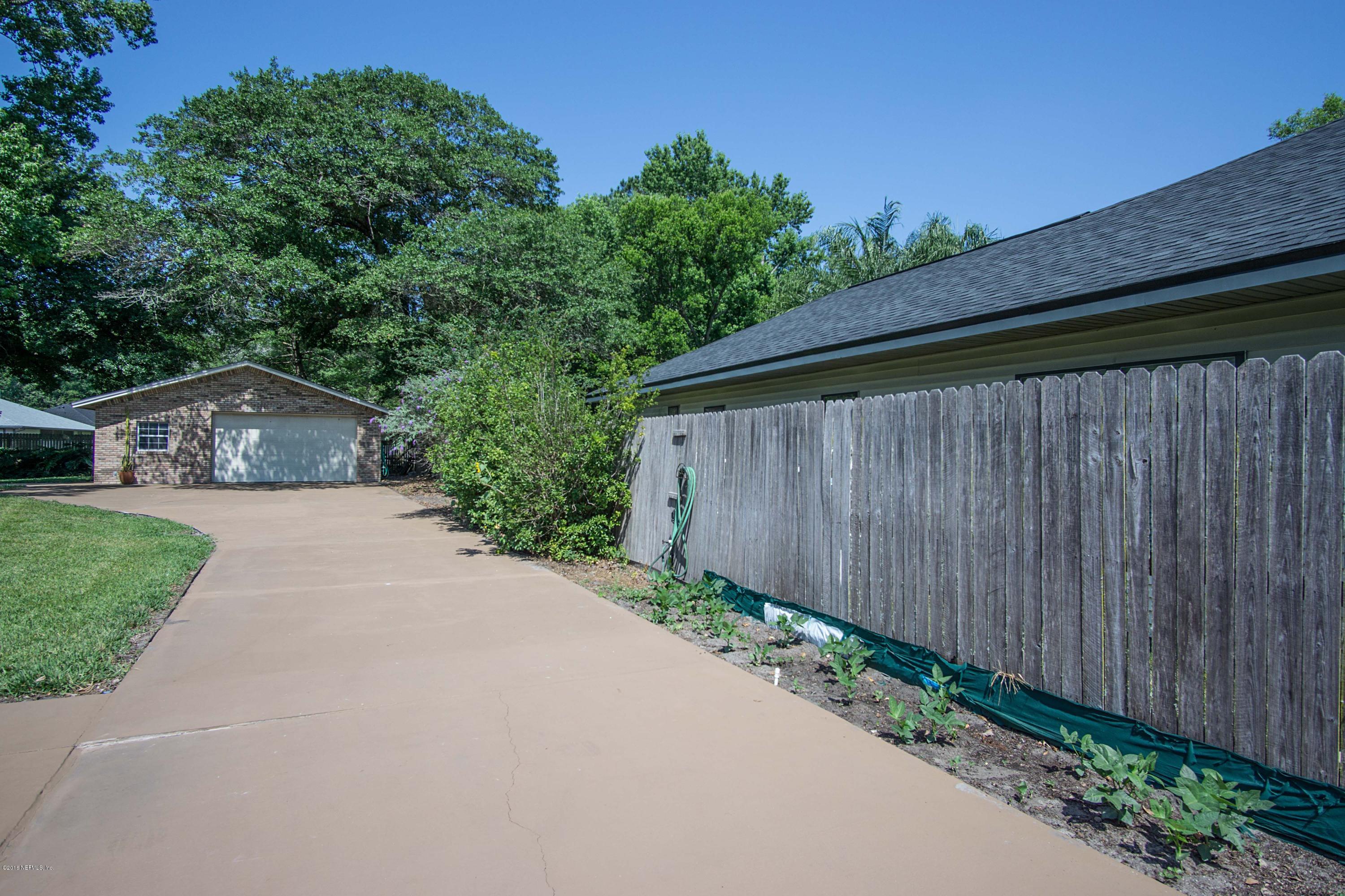 12552 Plummer Grant Road Jacksonville, FL 32258 - Photo 25 of 32 Driveway to Backyard