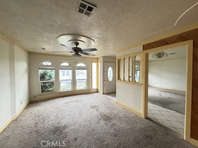 a kitchen with stainless steel appliances granite countertop a stove a sink dishwasher a refrigerator and a microwave