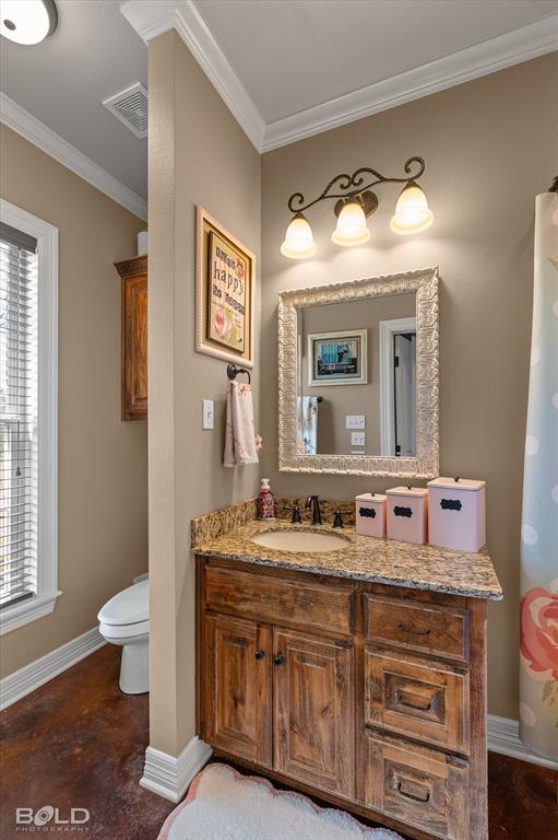 13870 Highway 157 Haughton, LA 71037 - Photo 25 of 40 a bathroom with a toilet sink and mirror
