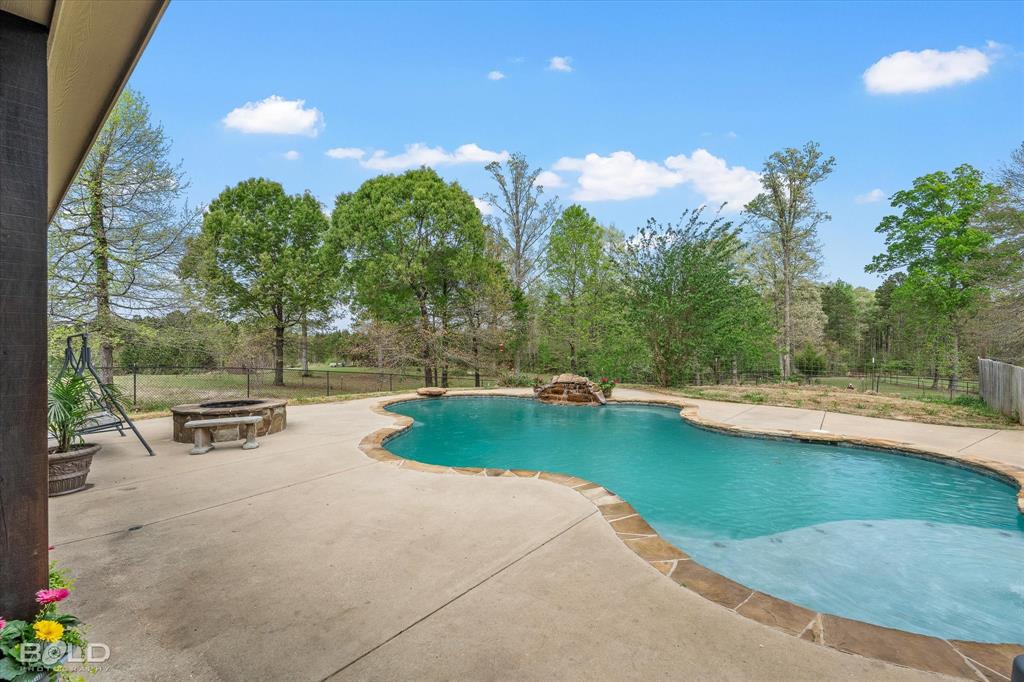 13870 Highway 157 Haughton, LA 71037 - Photo 31 of 40 a view of a swimming pool with a yard and sitting area