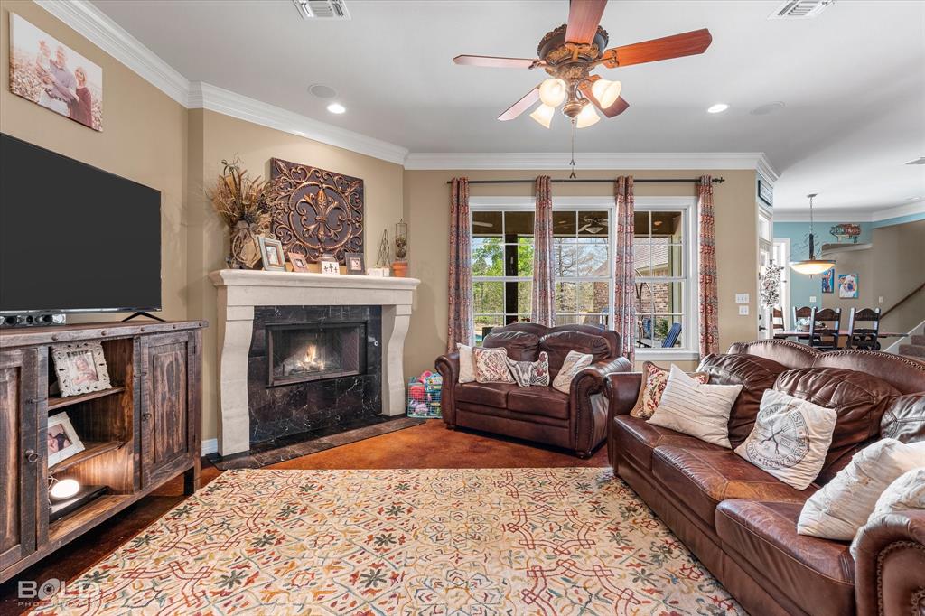 13870 Highway 157 Haughton, LA 71037 - Photo 8 of 40 a living room with furniture a flat screen tv and a fireplace