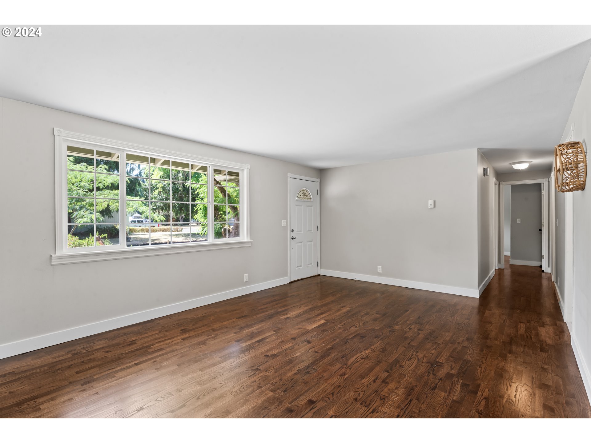 1320 Menlo Loop Springfield, OR 97477 - Photo 12 of 43 a view of an empty room with wooden floor and a window