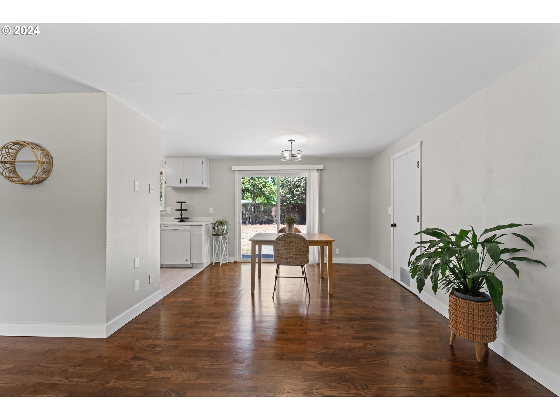 1320 Menlo Loop Springfield, OR 97477 - Photo 14 of 43 a view of a dining room with furniture and a potted plant