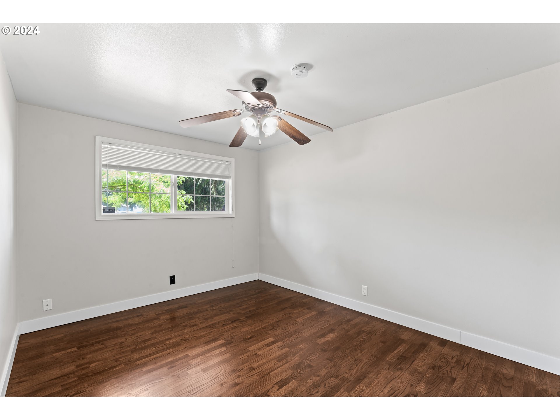 1320 Menlo Loop Springfield, OR 97477 - Photo 24 of 43 a view of an empty room with a window