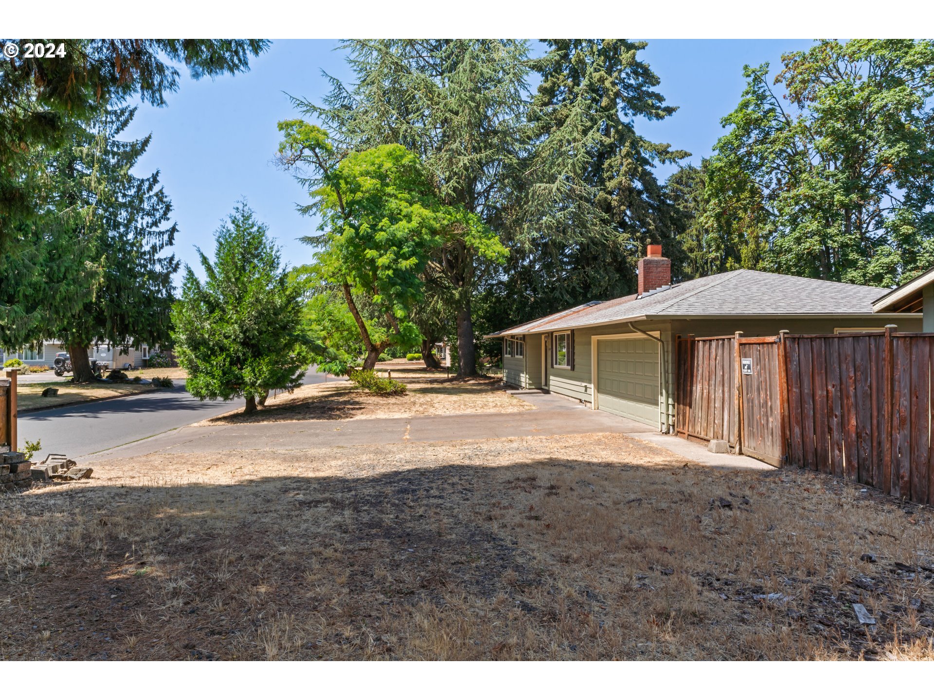 1320 Menlo Loop Springfield, OR 97477 - Photo 5 of 43 a view of a yard with a house and a tree