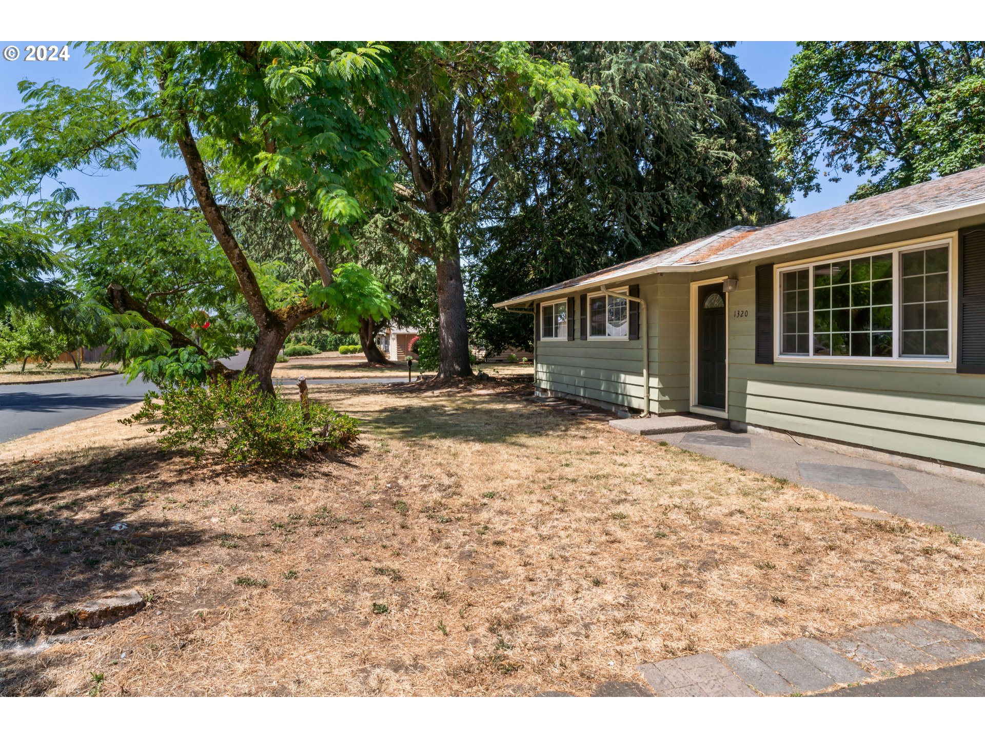 1320 Menlo Loop Springfield, OR 97477 - Photo 6 of 43 a backyard of a house with yard and outdoor seating