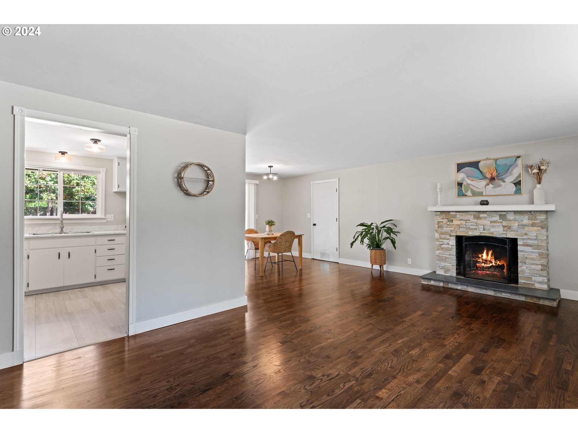 1320 Menlo Loop Springfield, OR 97477 - Photo 8 of 43 a view of a livingroom with wooden floor and a fireplace