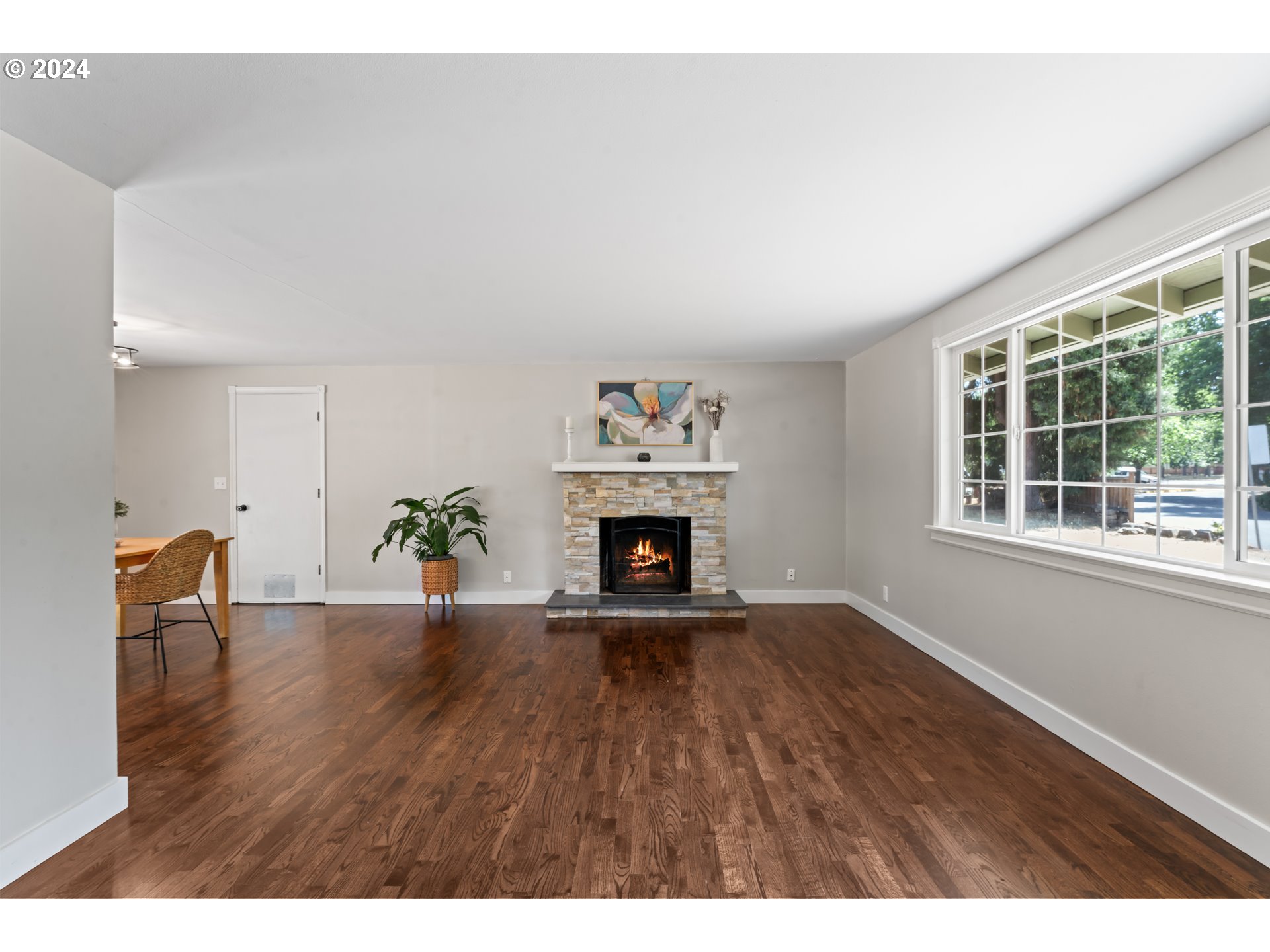 1320 Menlo Loop Springfield, OR 97477 - Photo 9 of 43 a view of an empty room with a window and fireplace