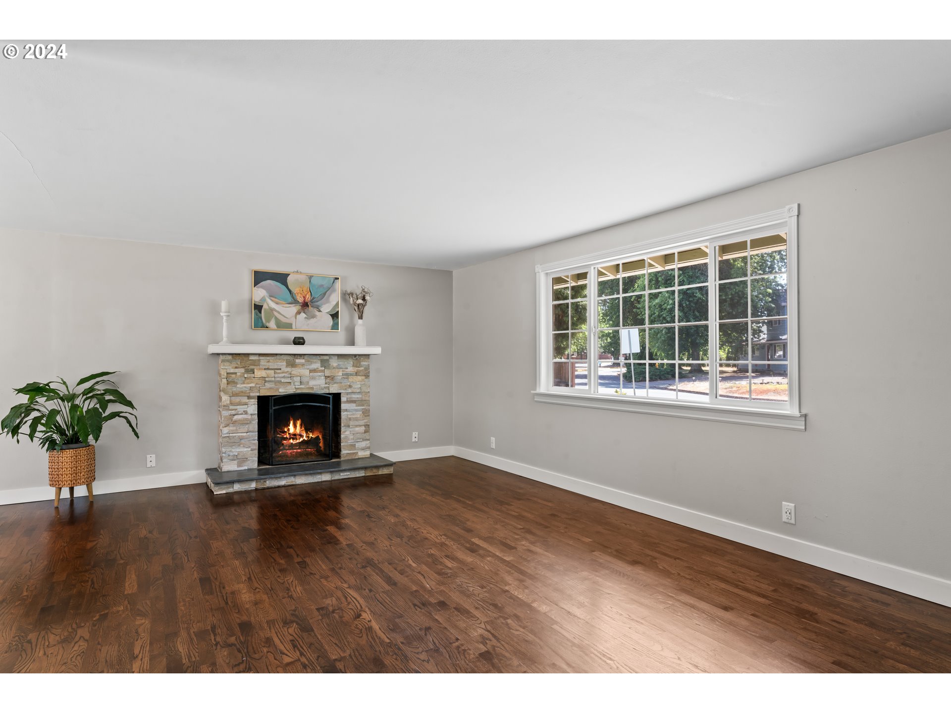 1320 Menlo Loop Springfield, OR 97477 - Photo 10 of 43 a view of an empty room with window and fire place