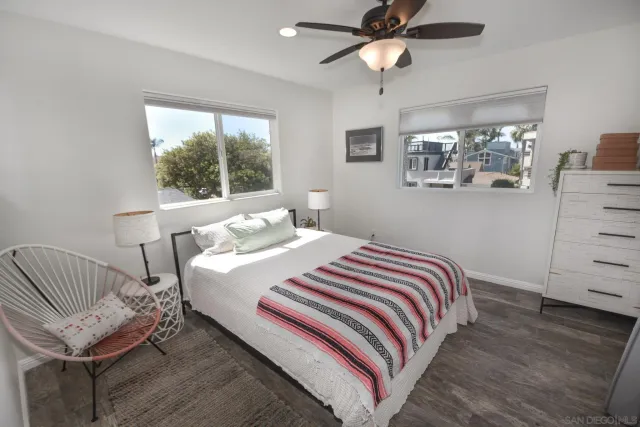 a bedroom with furniture and a window