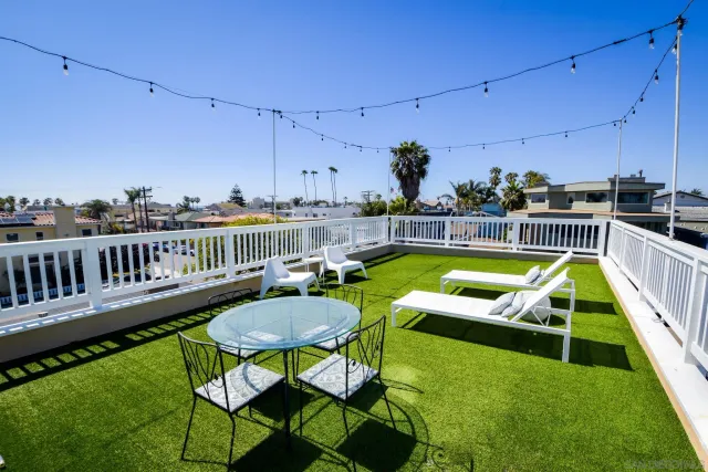 a view of a chairs and table in the patio