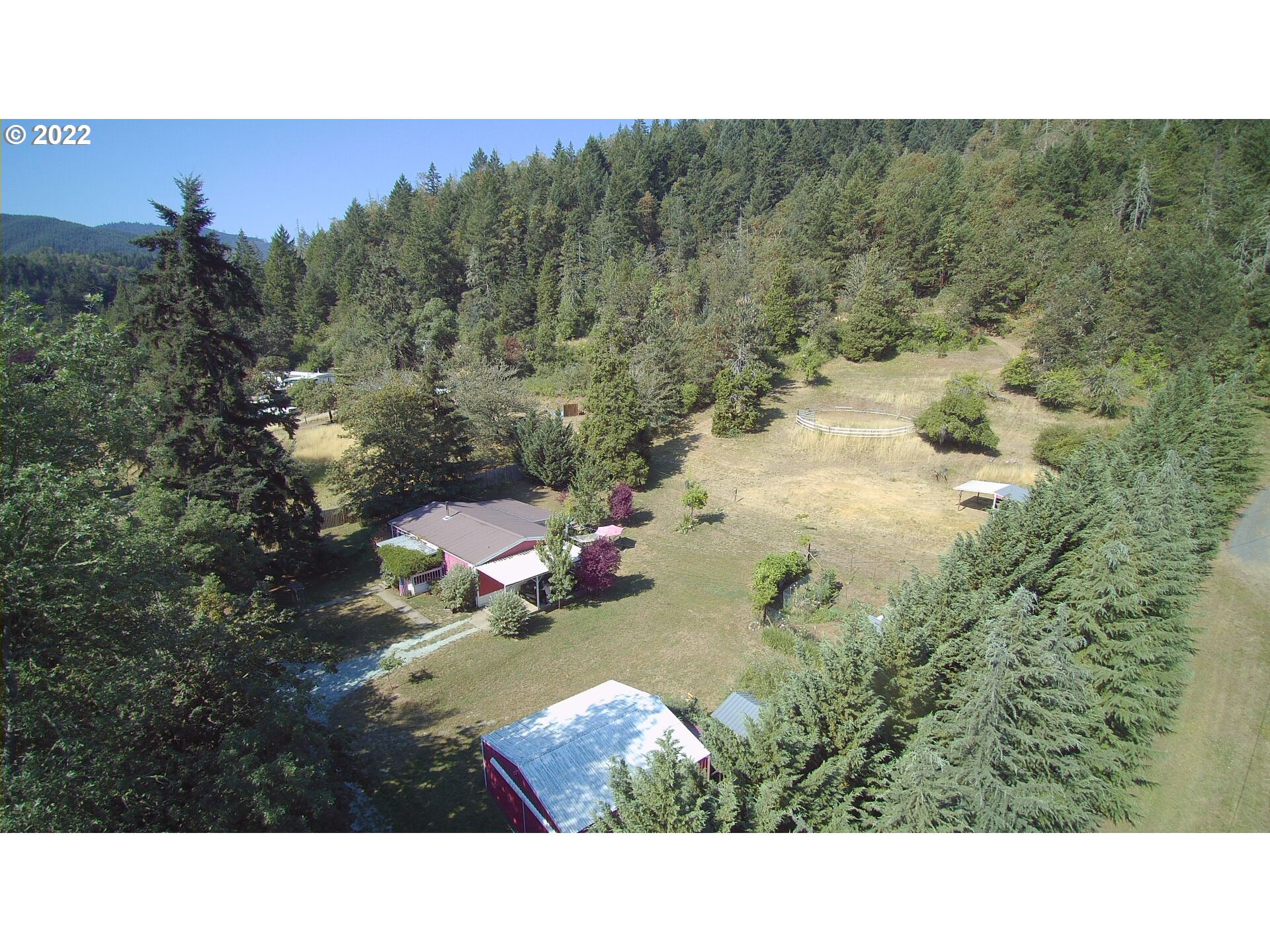 202 Homestake Lane Riddle, OR 97469 - Photo 1 of 31 a balcony with a view of city and tree
