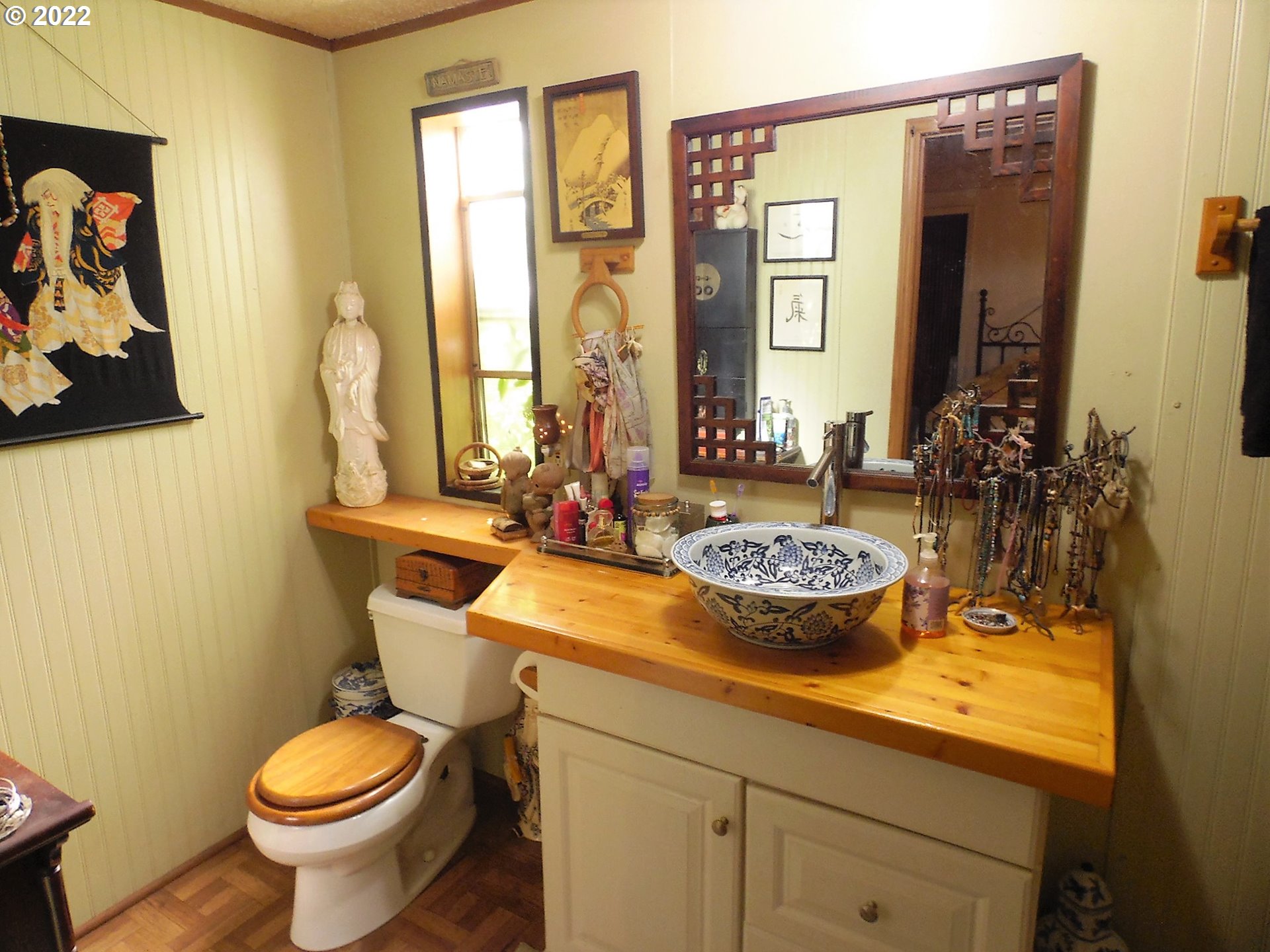 202 Homestake Lane Riddle, OR 97469 - Photo 14 of 31 a bathroom with a toilet sink and mirror