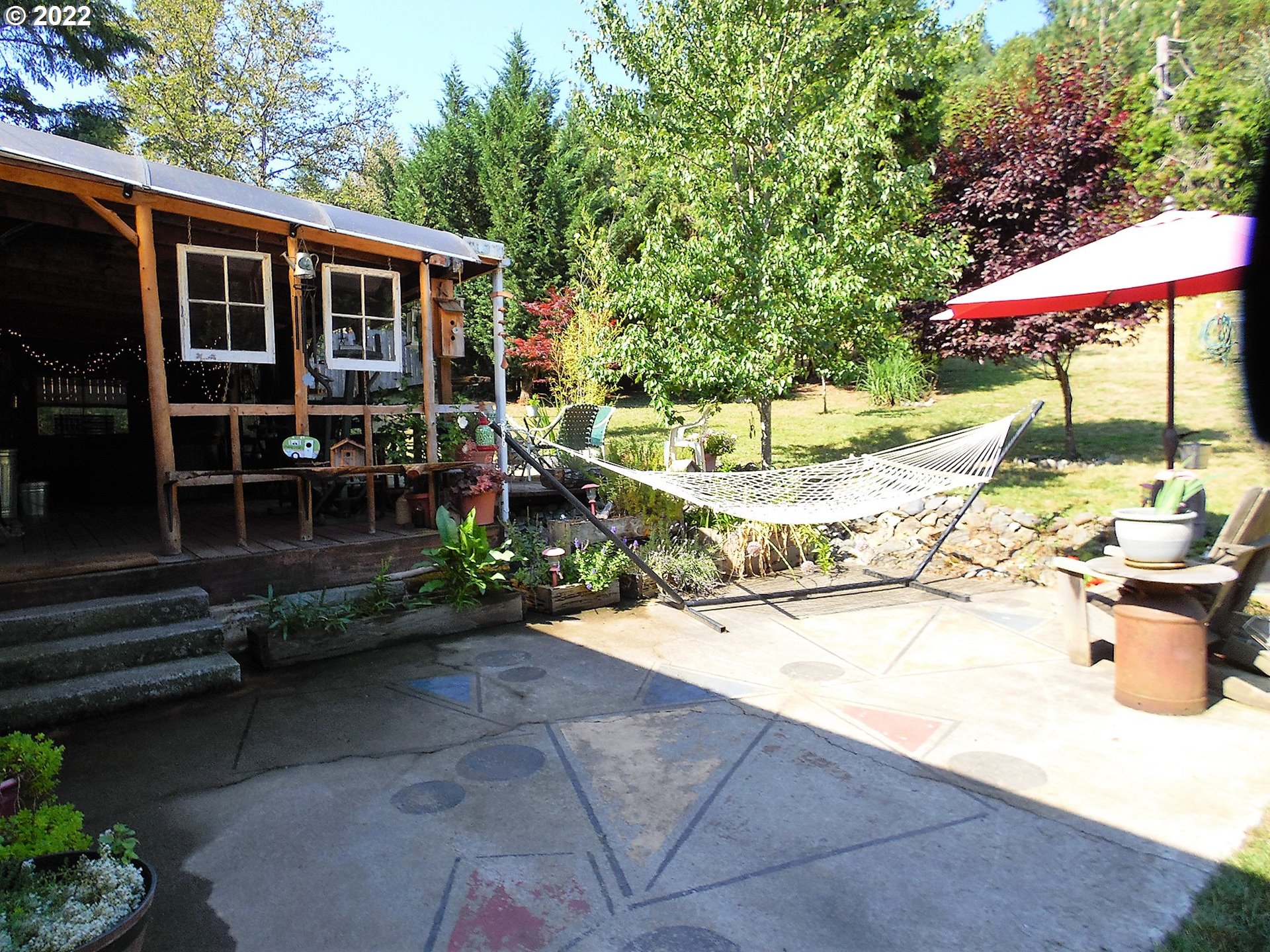 202 Homestake Lane Riddle, OR 97469 - Photo 17 of 31 a view of a house with backyard and sitting area