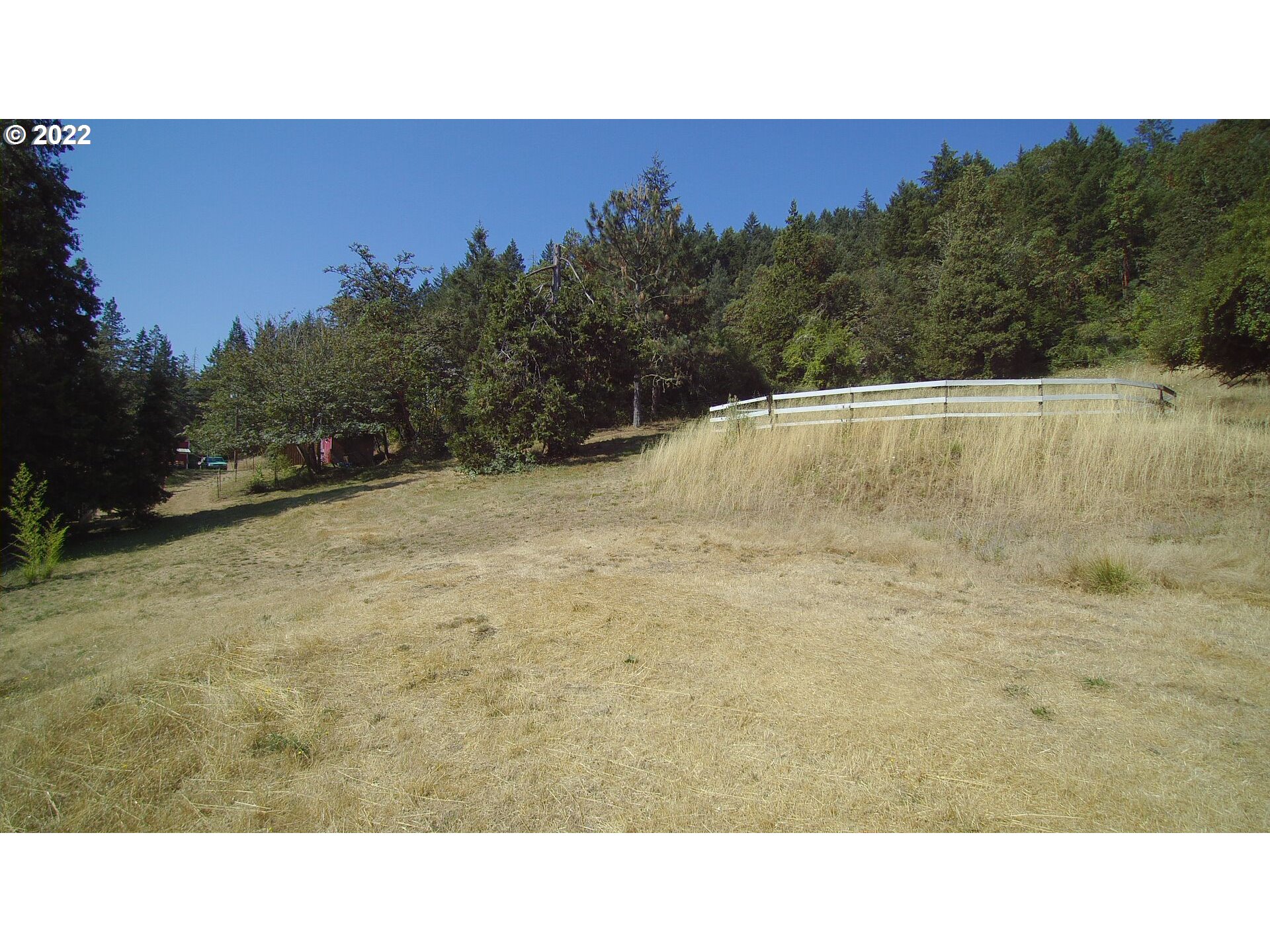 202 Homestake Lane Riddle, OR 97469 - Photo 28 of 31 a open area with mountains in the background