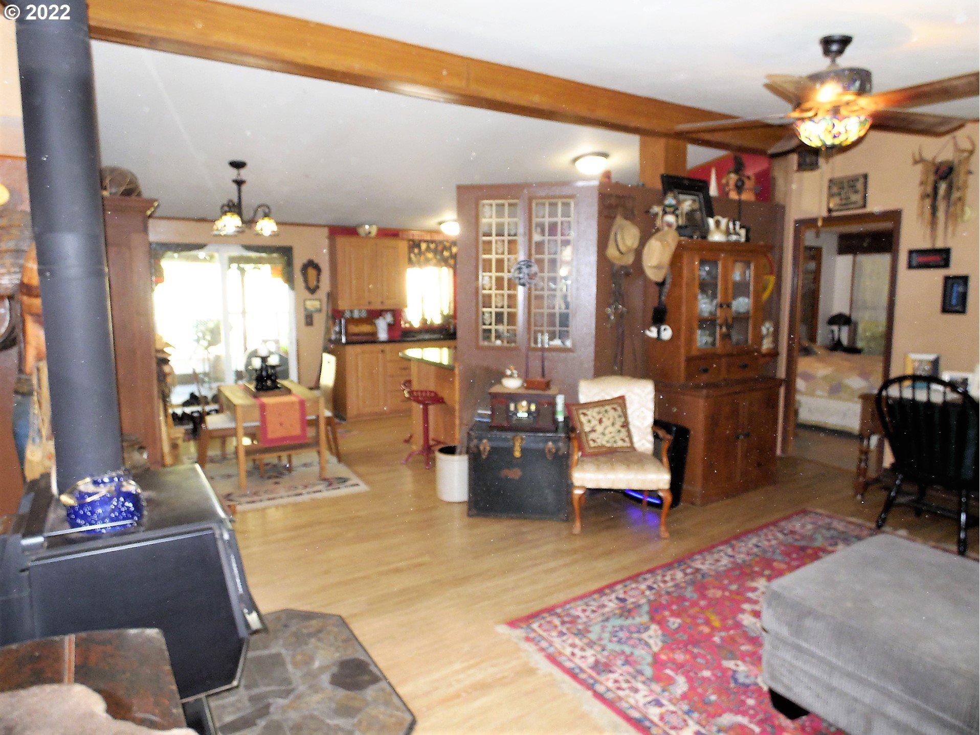 202 Homestake Lane Riddle, OR 97469 - Photo 3 of 31 a living room with furniture and a chandelier