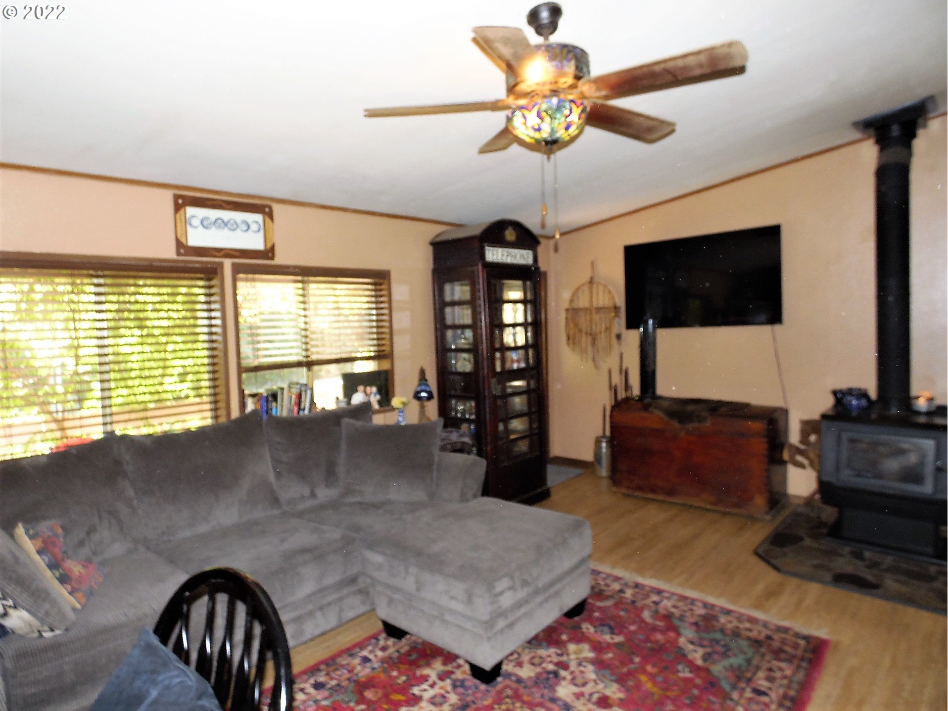 202 Homestake Lane Riddle, OR 97469 - Photo 4 of 31 a living room with furniture and a flat screen tv
