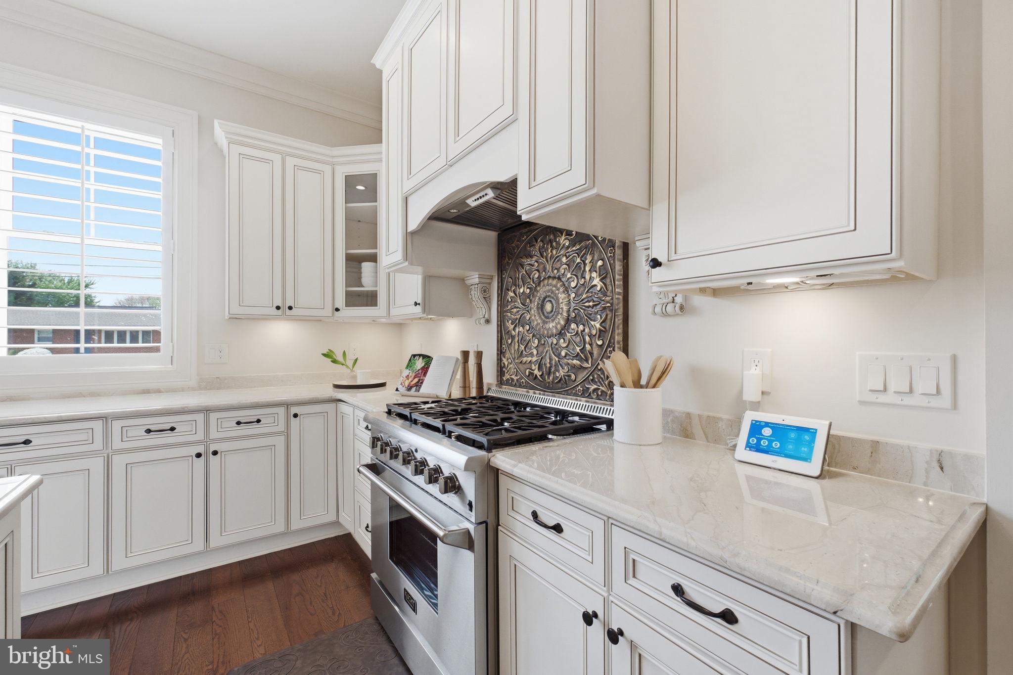 609 Kingsley Road Southwest Vienna, VA 22180 - Photo 12 of 47 a kitchen with stainless steel appliances granite countertop a sink stove and cabinets