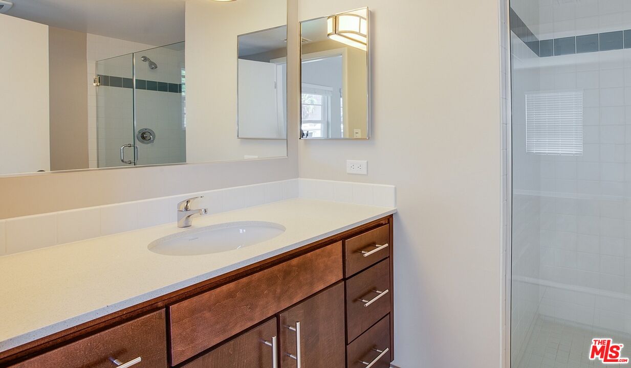 1012 Frederick Street, Unit 1 Venice, CA 90291 - Photo 7 of 10 a bathroom with a sink and a mirror