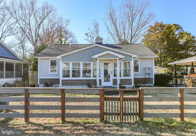a front view of a house with a porch