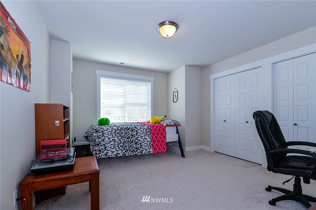 4423 220th Street Southeast Bothell, WA 98021 - Photo 19 of 24 a living room with furniture and a window