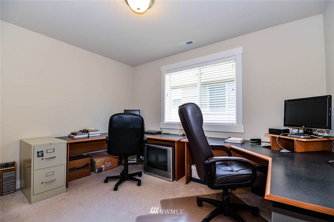 4423 220th Street Southeast Bothell, WA 98021 - Photo 20 of 24 a view of a workspace with furniture and a window