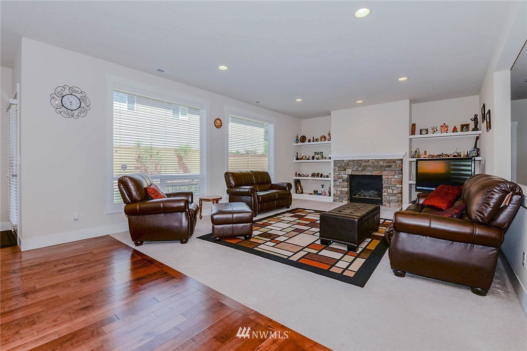 4423 220th Street Southeast Bothell, WA 98021 - Photo 3 of 24 a living room with furniture and a fireplace
