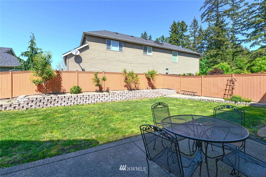 4423 220th Street Southeast Bothell, WA 98021 - Photo 23 of 24 a view of backyard with plants and outdoor seating