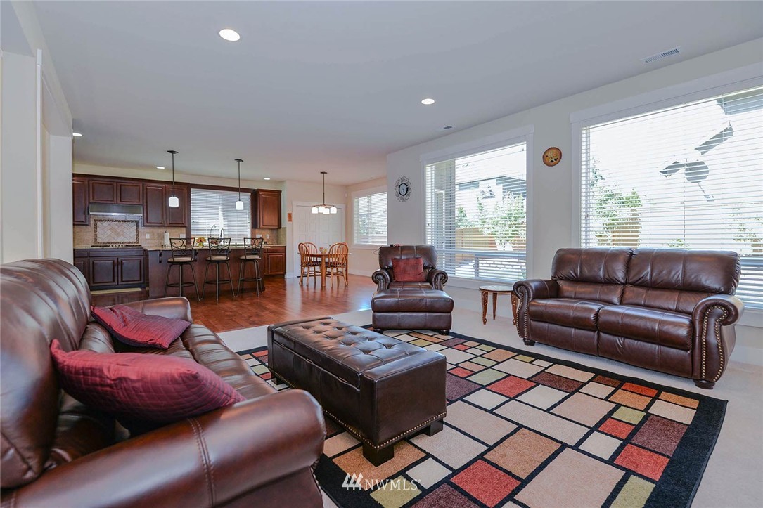 4423 220th Street Southeast Bothell, WA 98021 - Photo 4 of 24 a living room with furniture and a large window