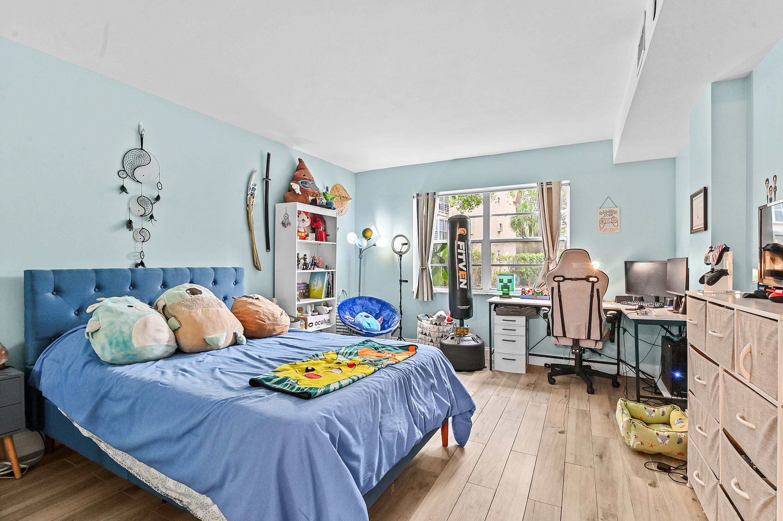 6400 Northwest 2nd Avenue, Unit 124 Boca Raton, FL 33487 - Photo 24 of 33 a bedroom with two beds and a large window