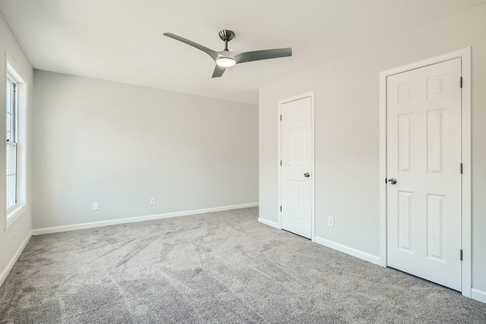 480 Rockwell Street Southwest Atlanta, GA 30310 - Photo 3 of 6 an empty room with a ceiling fan and a window