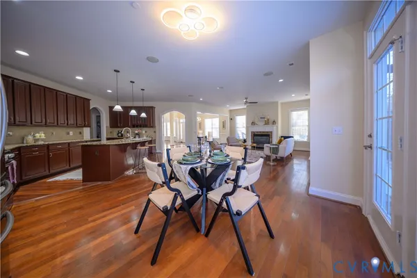 a view of a dining room with furniture and wooden floor
