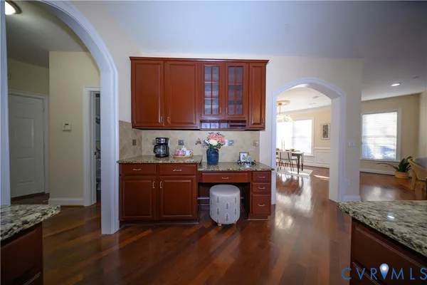 a kitchen with sink refrigerator and cabinets