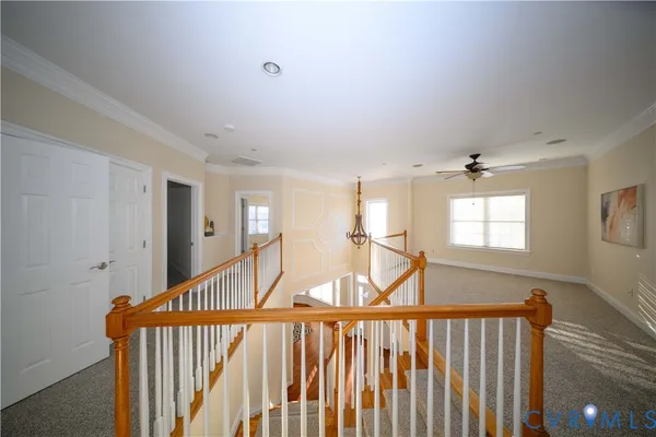 a view of staircase with wooden floor and windows