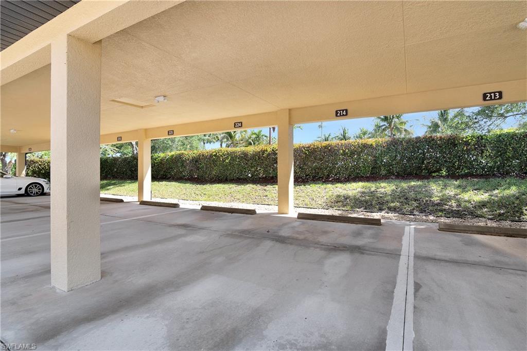 9719 Acqua Court, Unit 214 Naples, FL 34113 - Photo 26 of 50 a view of a building with a street