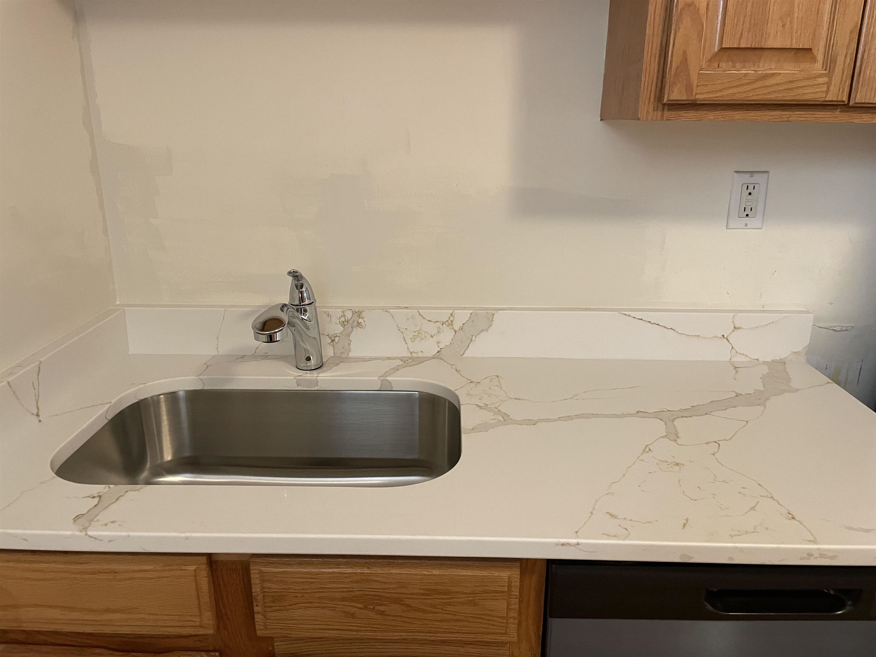 421 Adams Street, Unit 2L Hoboken, NJ 07030 - Photo 5 of 19 a bathroom with a sink and cabinets