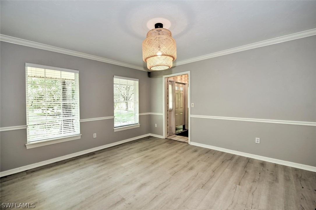 15180 Briar Ridge Circle Fort Myers, FL 33912 - Photo 11 of 35 a view of empty room with wooden floor and fan