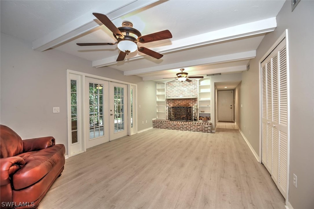 15180 Briar Ridge Circle Fort Myers, FL 33912 - Photo 16 of 35 a view of empty room with wooden floor and fan