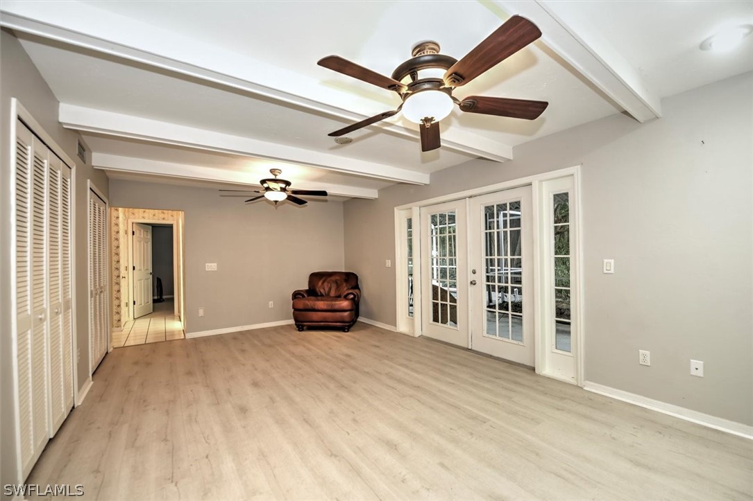 15180 Briar Ridge Circle Fort Myers, FL 33912 - Photo 18 of 35 a view of a livingroom with a ceiling fan and wooden floor