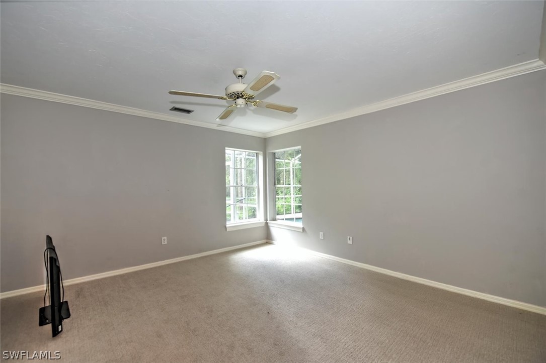 15180 Briar Ridge Circle Fort Myers, FL 33912 - Photo 19 of 35 wooden floor in an empty room with a window