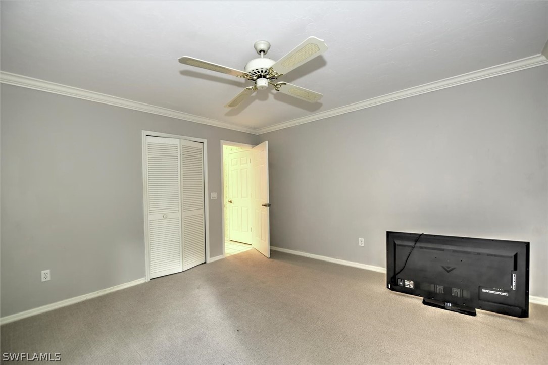 15180 Briar Ridge Circle Fort Myers, FL 33912 - Photo 20 of 35 a view of a livingroom with a ceiling fan and window