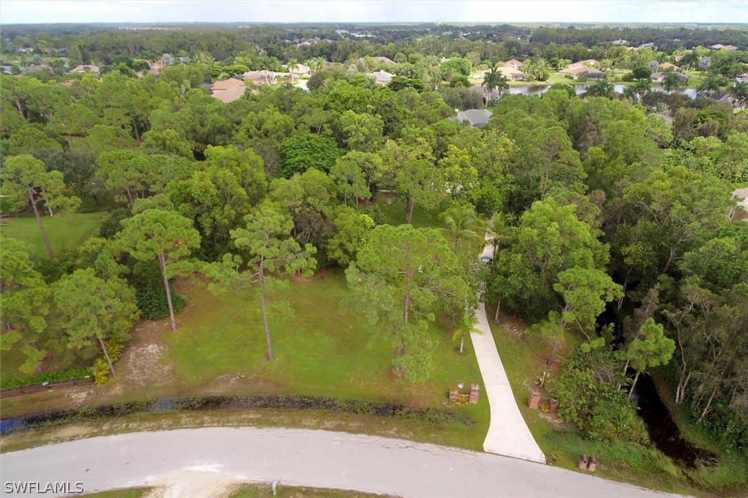 15180 Briar Ridge Circle Fort Myers, FL 33912 - Photo 2 of 35 an aerial view of residential houses with outdoor space