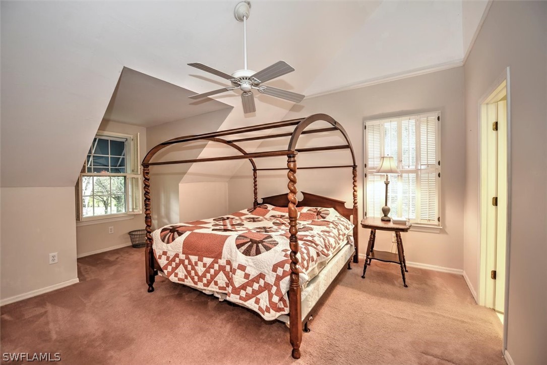 15180 Briar Ridge Circle Fort Myers, FL 33912 - Photo 24 of 35 a bed sitting in a bedroom next to a window