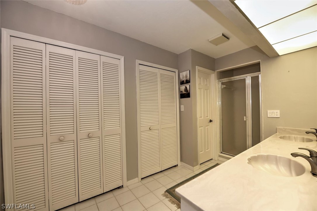 15180 Briar Ridge Circle Fort Myers, FL 33912 - Photo 25 of 35 a bedroom with a bed and a window