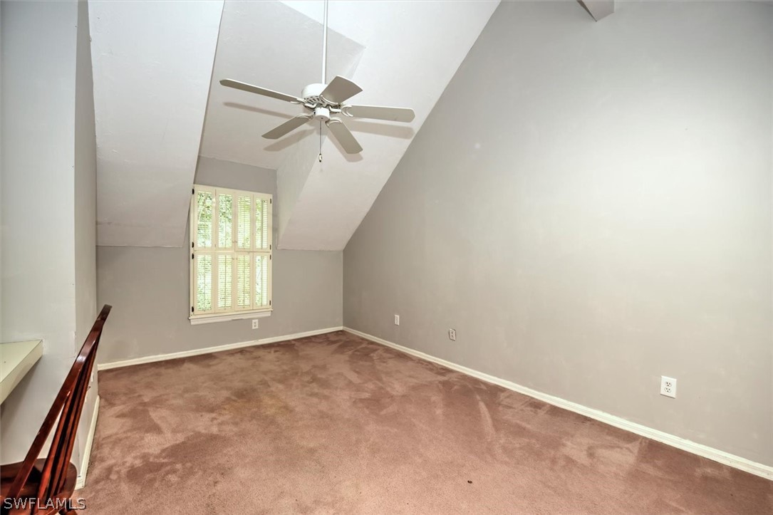 15180 Briar Ridge Circle Fort Myers, FL 33912 - Photo 28 of 35 an empty room with windows and fan