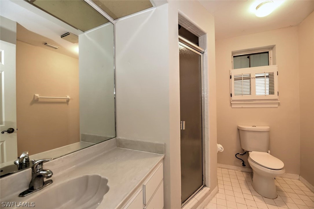 15180 Briar Ridge Circle Fort Myers, FL 33912 - Photo 30 of 35 a bathroom with a sink toilet and shower