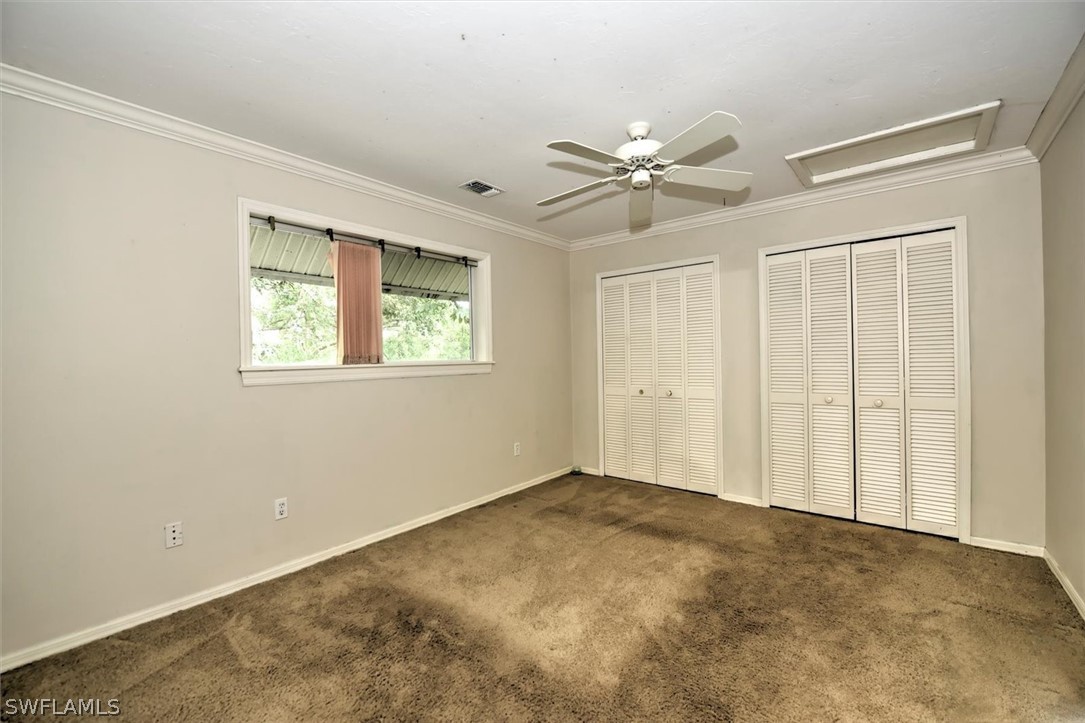 15180 Briar Ridge Circle Fort Myers, FL 33912 - Photo 31 of 35 a view of an empty room with a window