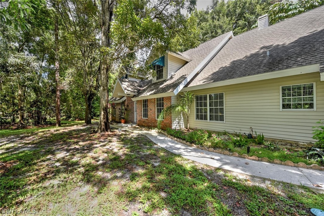 15180 Briar Ridge Circle Fort Myers, FL 33912 - Photo 6 of 35 a view of a house with a yard